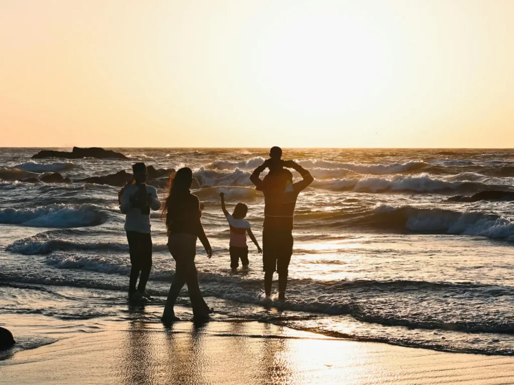 Family Enjoying Sunset at Beach